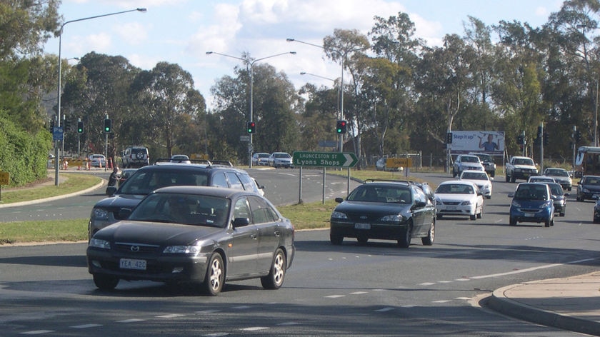 Cars driving along roadway, Melrose Drive Woden Canberra