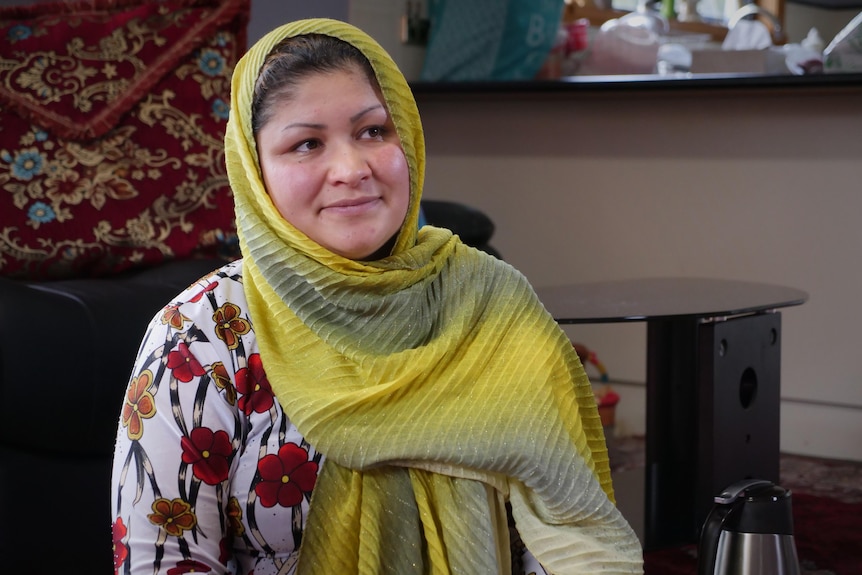 A Hazara woman in yellow headscarf