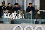 Diplomats watch the closing ceremony