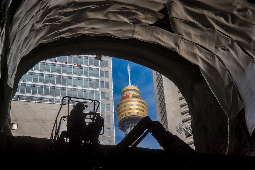 Sydney Tower can spotted outside of escalator shaft