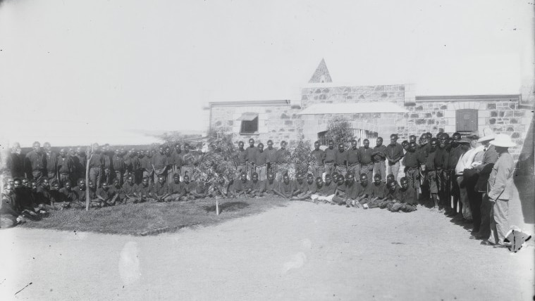 Aboriginal prisoners in the courtyard of the Rottnest Island Prison, circa 1883.