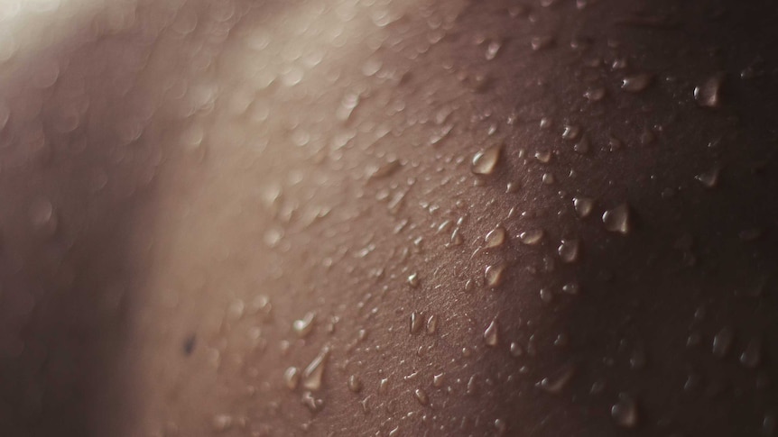 Close up of skin covered in drops of sweat