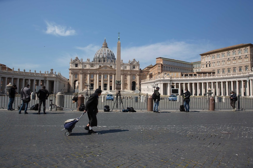 Journalists at empty St Peter's Square