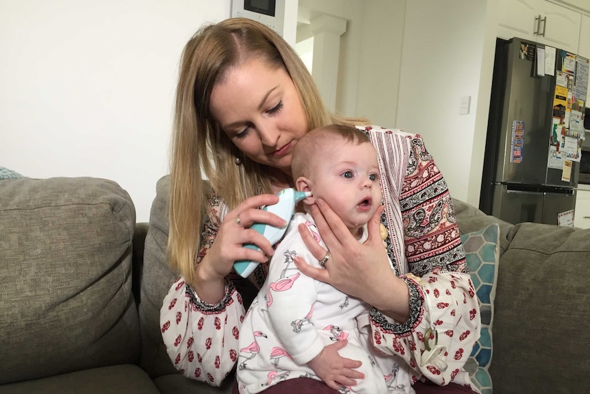 Kendall Marriott holds her five-month-old baby Ivy.