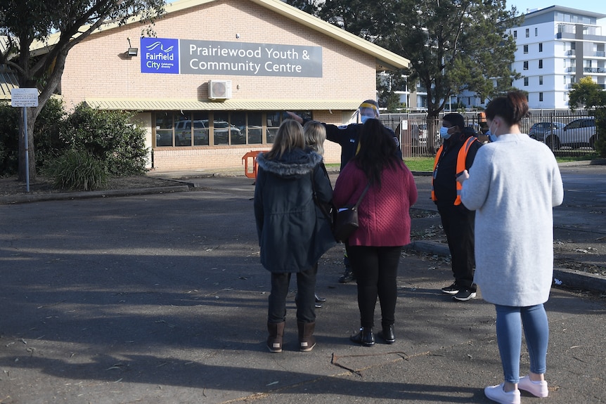 a group of people outside a building