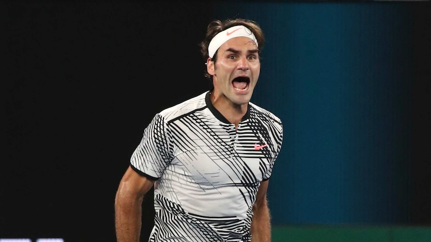 Federer celebrates winning the Australian Open