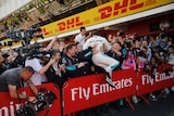Mercedes driver Lewis Hamilton of Britain celebrates after winning the Spanish F1 Grand Prix.
