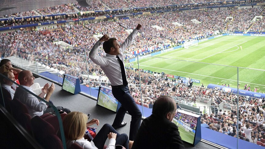 French President Emmanuel Macron leaps into the air during the World Cup final