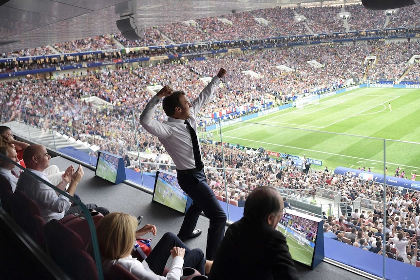 French President Emmanuel Macron leaps into the air during the World Cup final