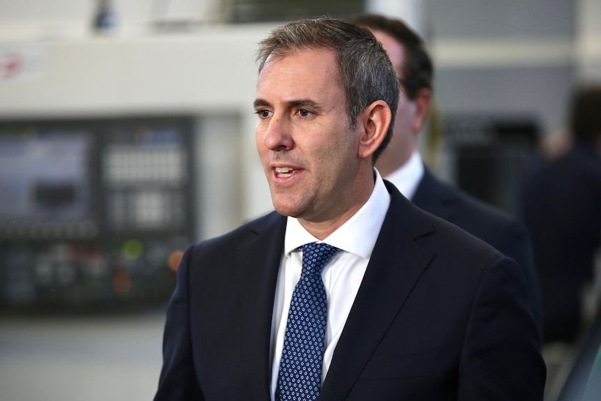 A head and shoulders shot of federal Treasurer Jim Chalmers speaking at a media conference.