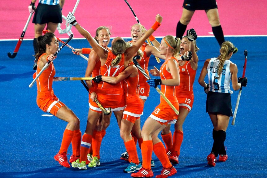 The Netherlands women's hockey team celebrates a goal during their 2-0 win over Argentina.