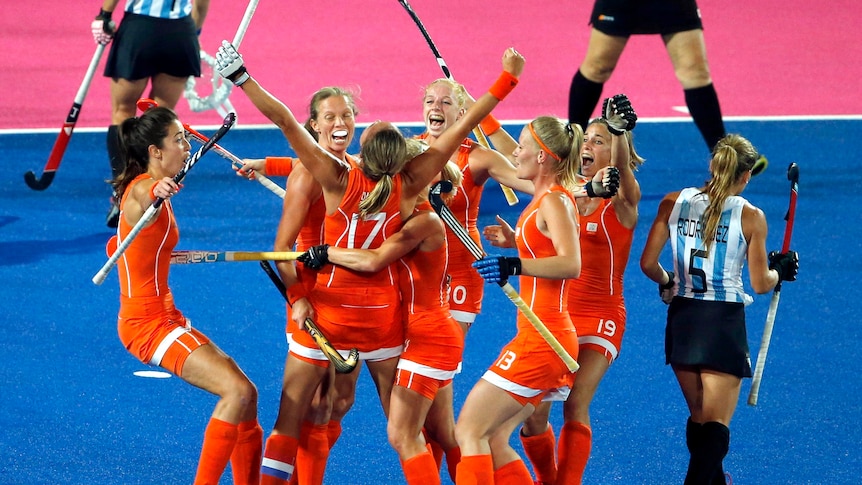 The Netherlands women's hockey team celebrates a goal during their 2-0 win over Argentina.