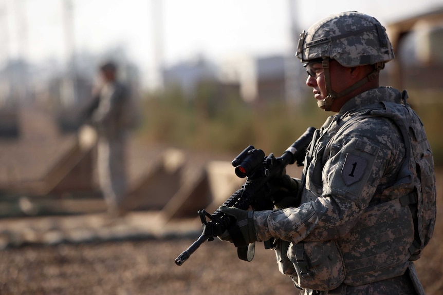 An American soldier stands guard.