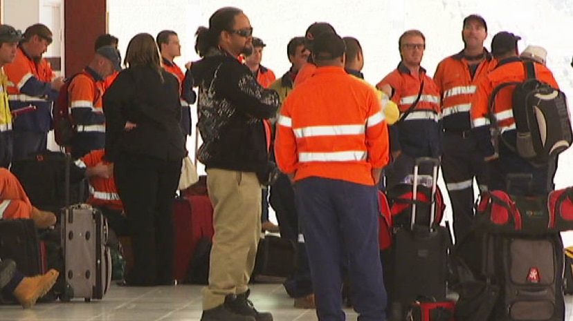 Mine workers wait at Perth Airport