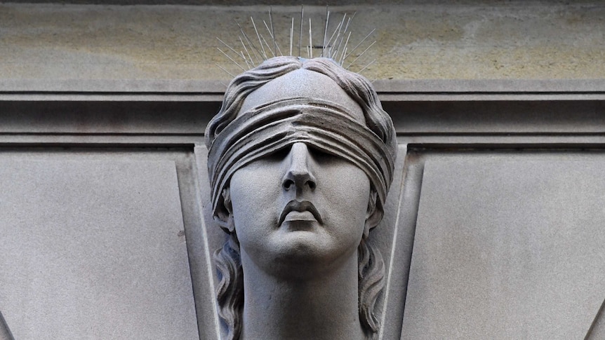 Statue of Lady Justice is seen on Central Local Court in Sydney