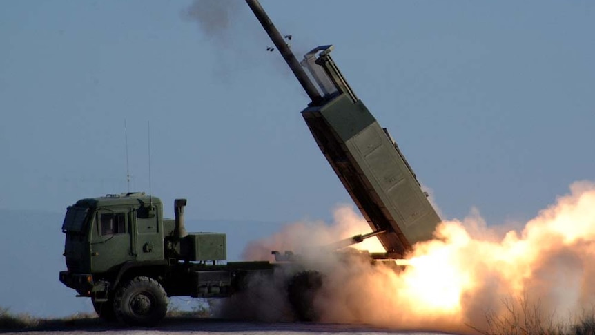 A missile launches from the back of a truck. 