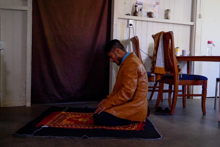 Hussain praying at his house in Gatton, Queensland June 2022.
