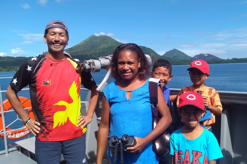 The Deka family pose for a photo aboard a Japanese navy ship at Rabaul, Papua New Guinea.