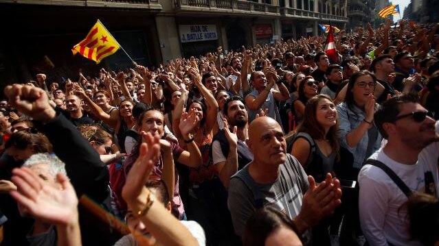 People protest in front of Spanish police building, Barcelona