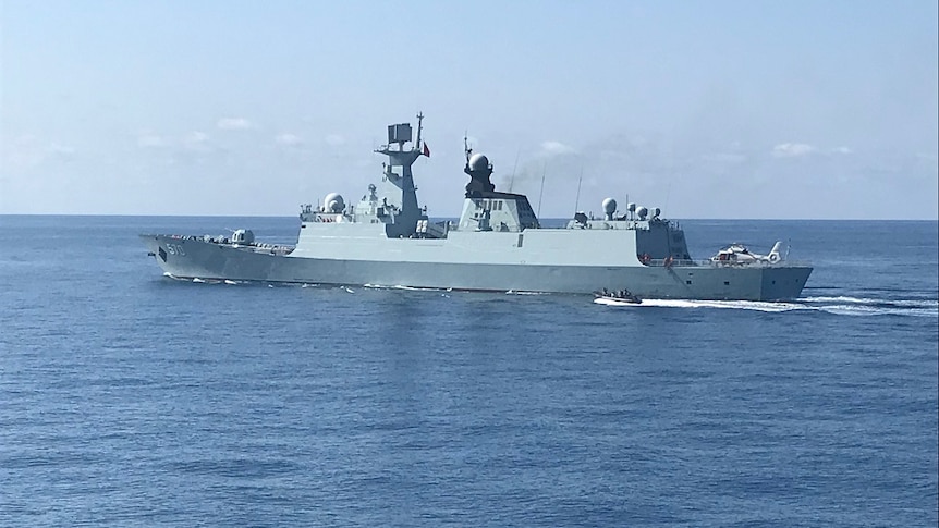 HMAS Newcastle spots visiting Chinese warship the Huangshan in the Timor Sea.