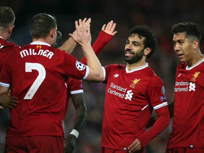 Mohamed Salah, celebrates with his teammates.