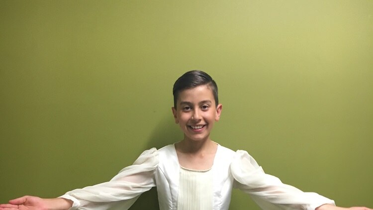 A 13 year old boy dressed in his ballet costume