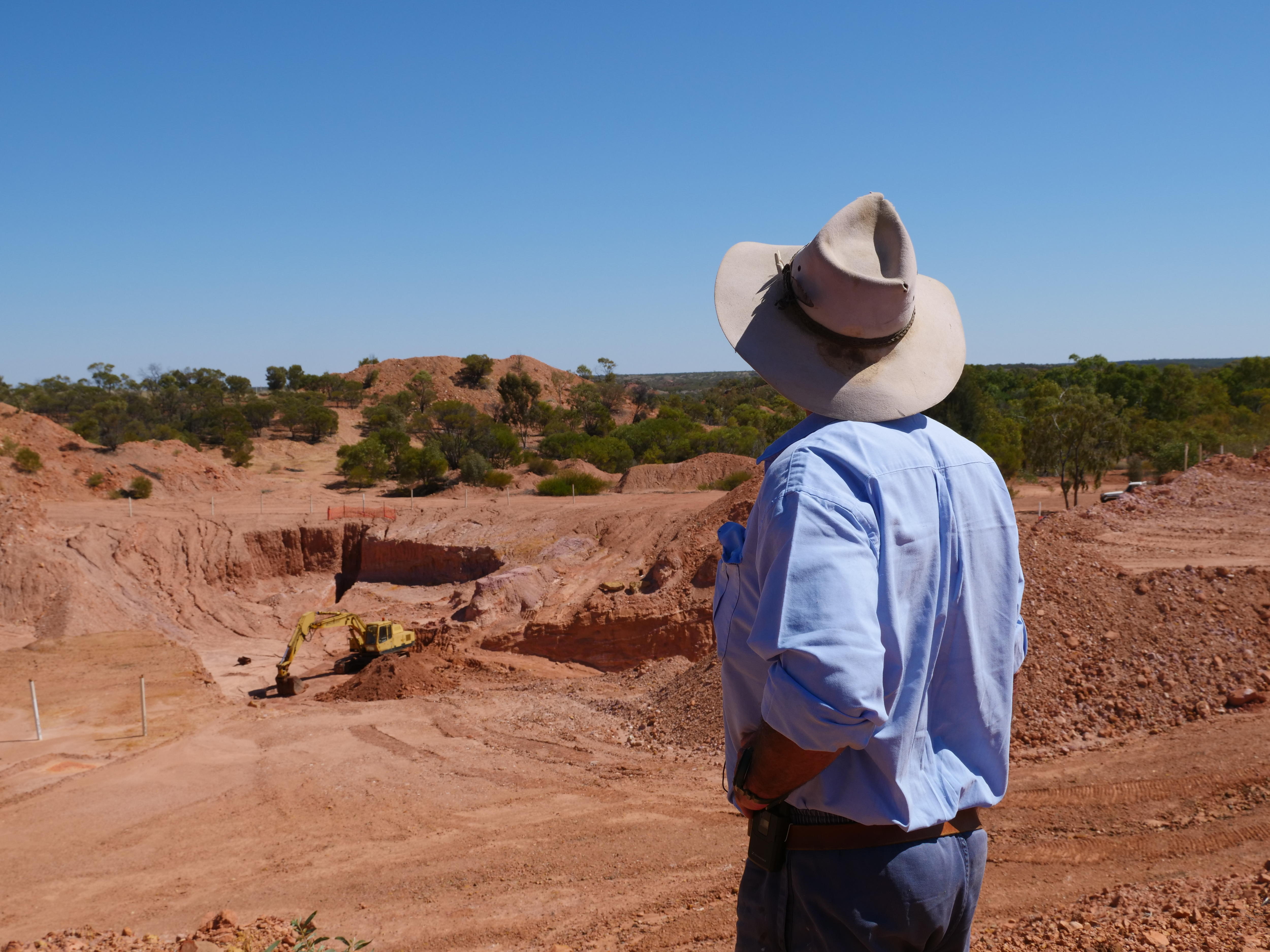 Opal miner inspecting excavation site
