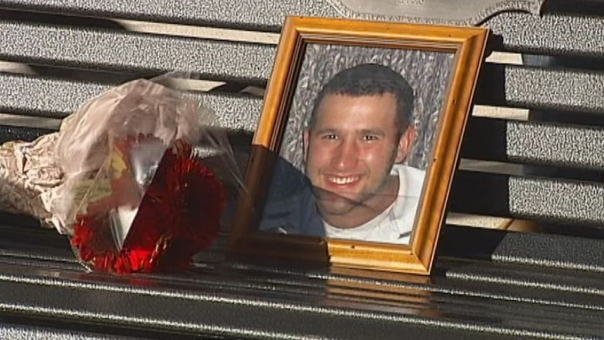 Picture of Ben Catanzariti on a memorial park bench