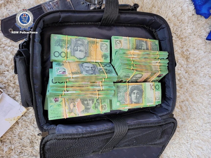Stacks of 100 dollar bills in a briefcase.