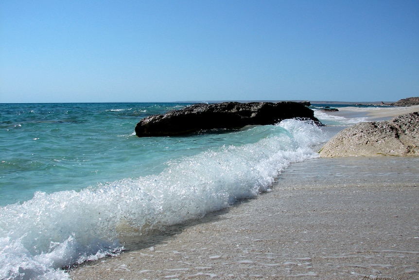 Waves crashing onto the shore.