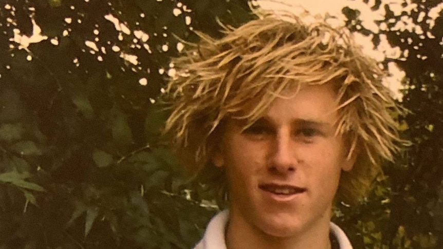 A teenage Jamin Heppell with blond dreadlocks.