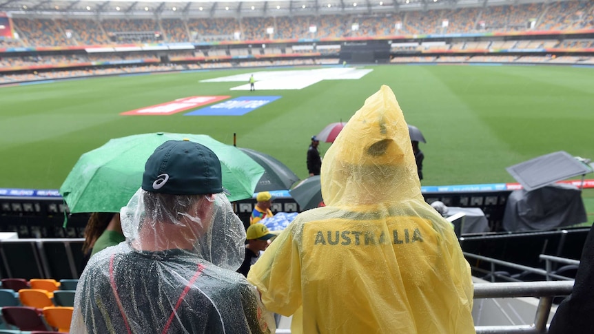 Spectators watch on at rained-out Gabba