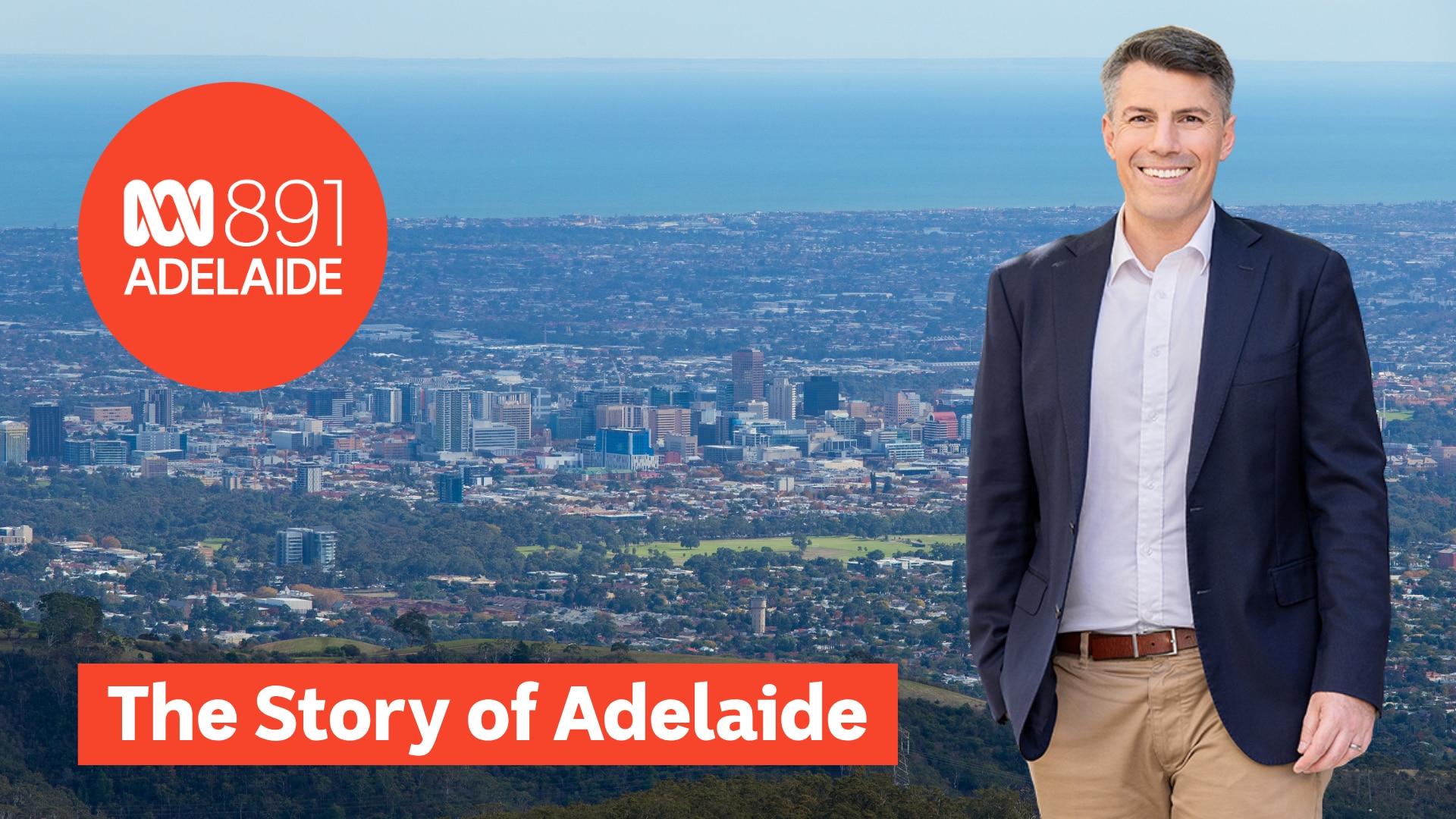 Rory McClaren in front of Adelaide city skyline