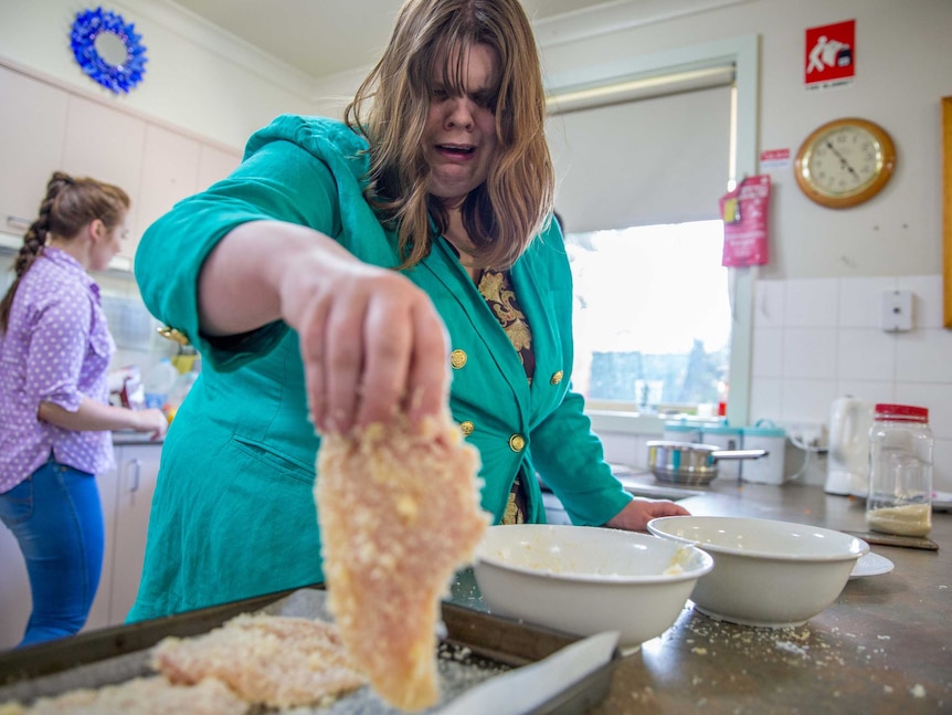 Kara crumbs chicken at respite care.