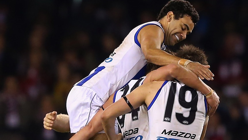 On top ... The Kangaroos celebrate a goal against the Saints