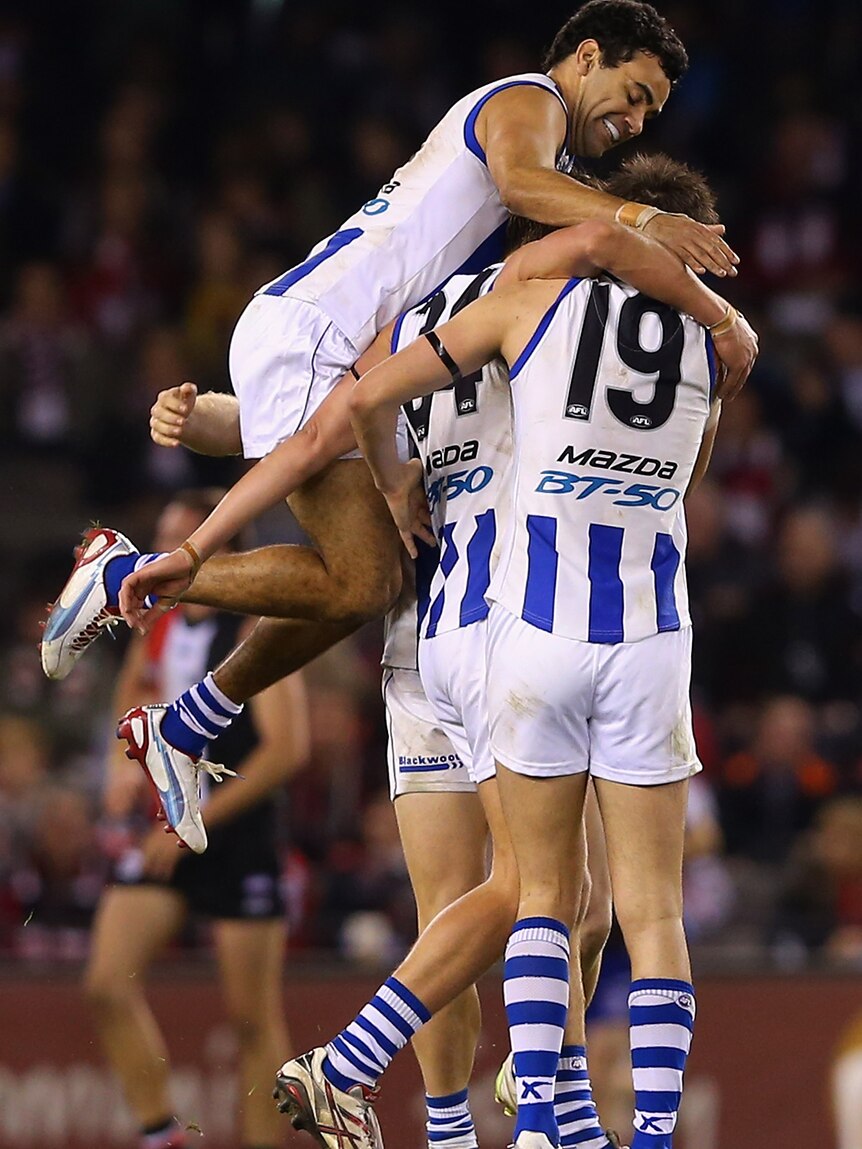 On top ... The Kangaroos celebrate a goal against the Saints