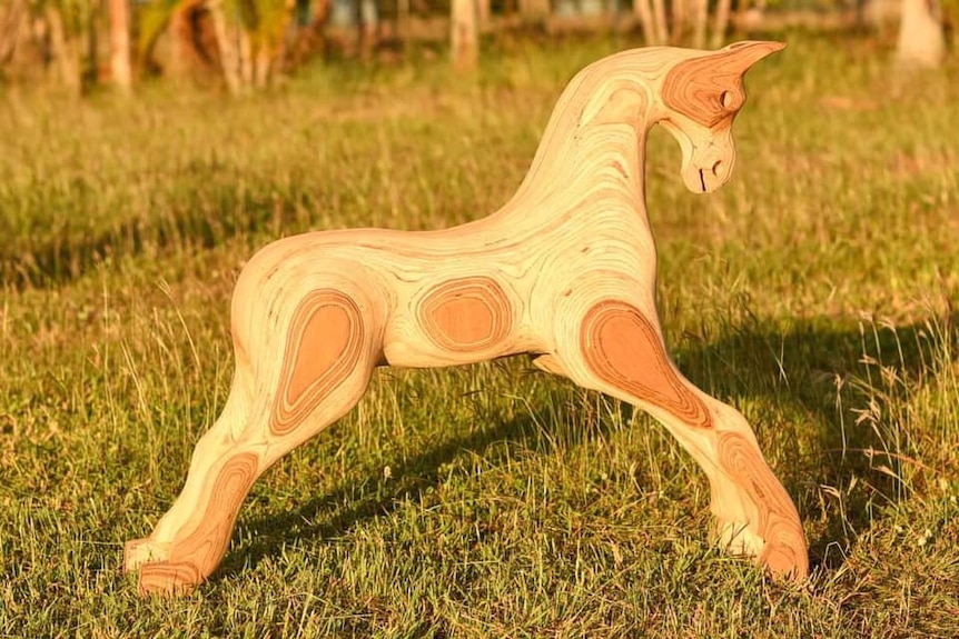 A wooden horse without any tail, main or saddle, yet to be added before it becomes a rocking horse.