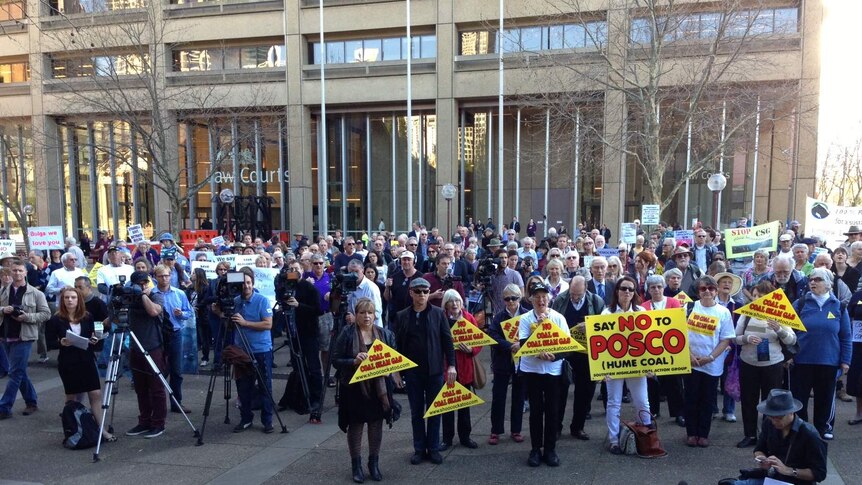 Anti-mining protesters gather outside the NSW Supreme Court for the case involving the Mt Thorley Warkworth mine.