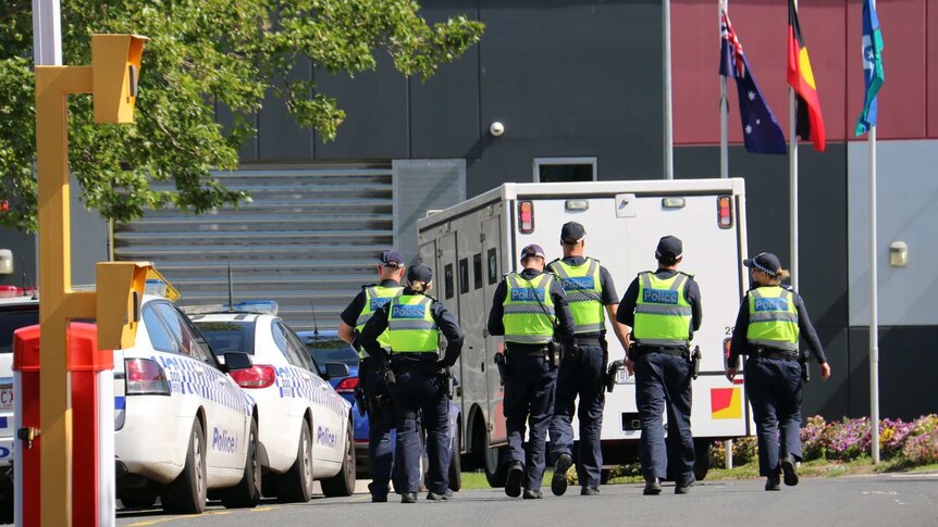 Police officers are working with youth justice centre staff, as inmates riot inside.
