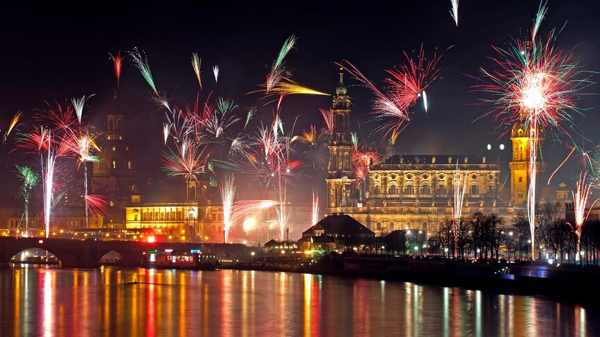 Fireworks erupt over the Elbe River in Dresden.