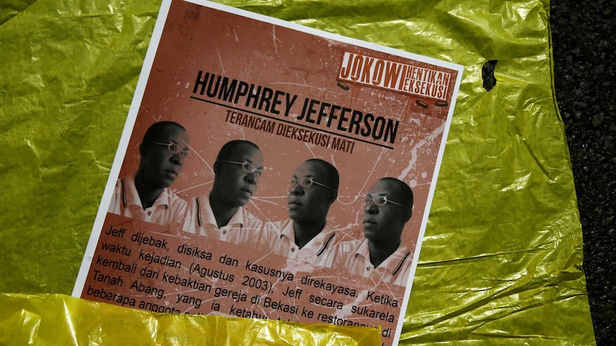 Poster with Humphrey Jefferson's picture lies on the ground.