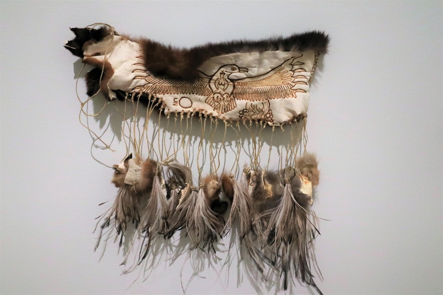 Possum skin dance belt with emu feathers and burnt design of wedge tail eagle