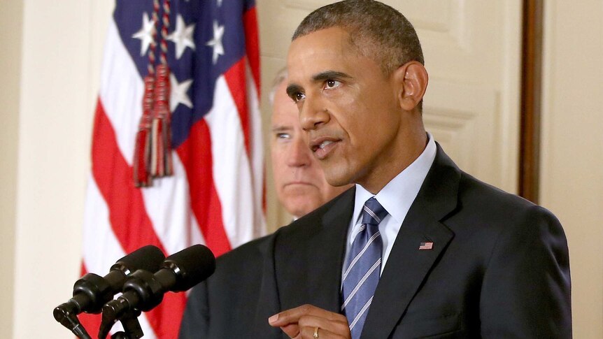 Barack Obama, standing with Joe Biden, speaks about the Iran nuclear deal.