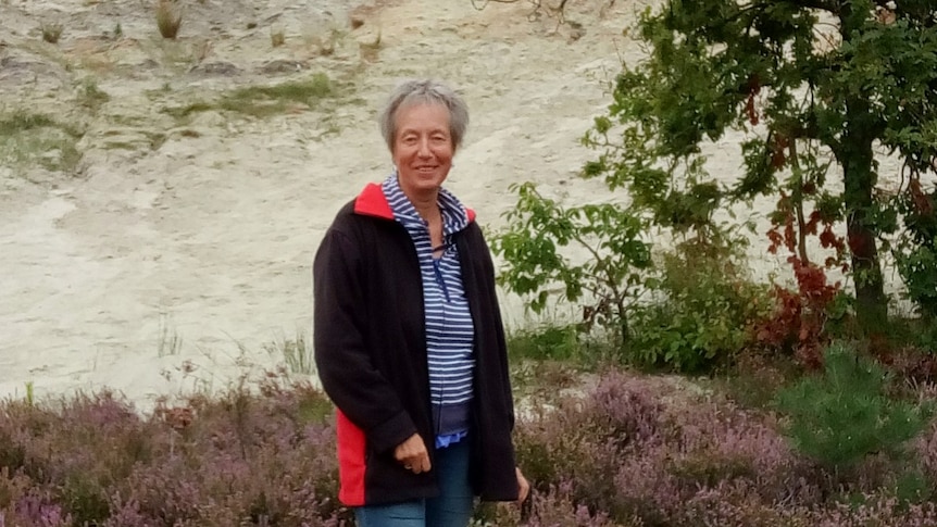 Woman standing outside in heather.