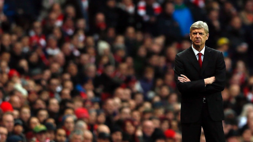 Season in tatters ... Arsenal manager Arsene Wenger looks on during his side's 2-0 home loss to Swansea.