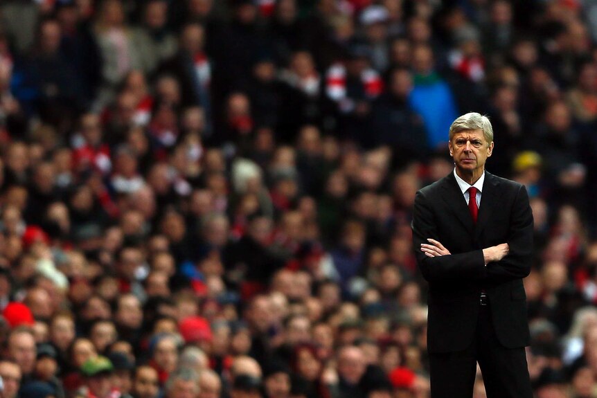 Season in tatters ... Arsenal manager Arsene Wenger looks on during his side's 2-0 home loss to Swansea.