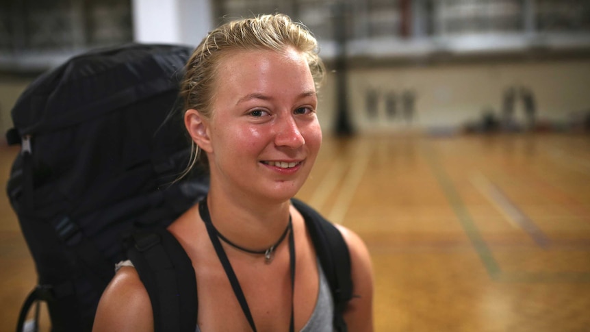 German backpacker Clarissa Widder standing inside the evacuation centre.