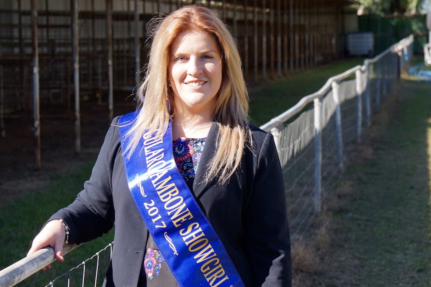 The 2017 Gulargambone Showgirl Abbey Morris standing at the local showground.