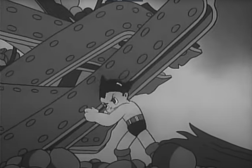A black and white image of Astro Boy carrying heavy metals.