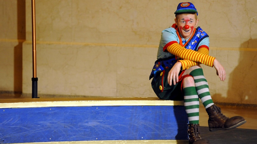 A Ringling Bros and Barnum & Bailey clown looks on during clown auditions.